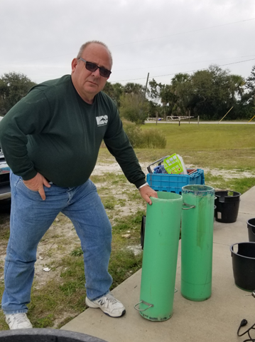 Chris Nelson helps fix oyster funnels in late 2019