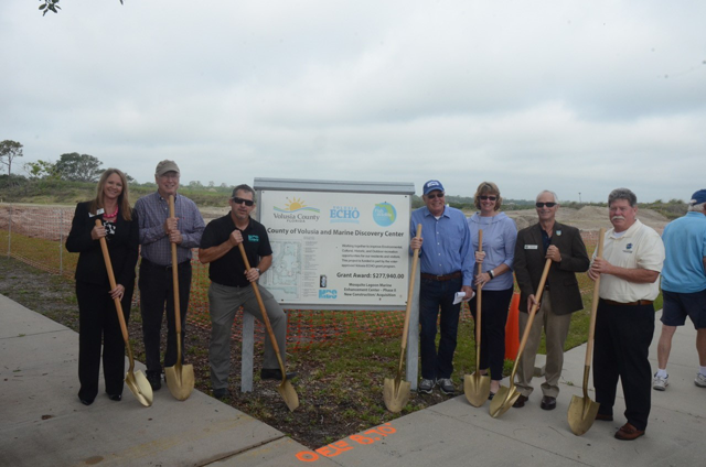 Fielding (right of sign) poses with other stakeholders at the 2018 groundbreaking for Hunter Amphitheater