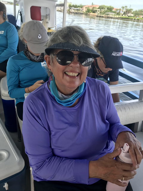Leigh rides along on the MDC boat during camp
